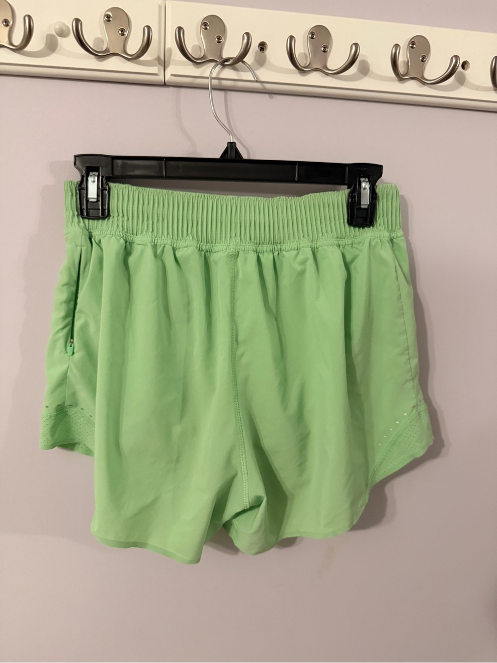 Lululemon Women’s Light Green Athletic Shorts and white razorback tank top